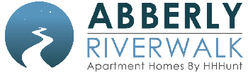 a sign that says abbey riverwalk on a green background