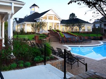 Relax poolside at Abberly Green Apartment Homes by HHHunt, North Carolina