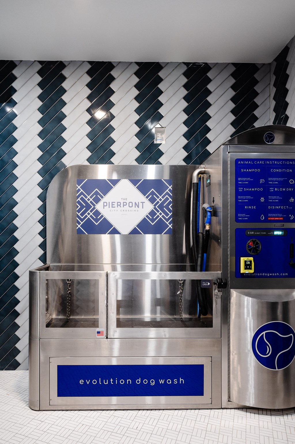 a refrigeration machine in a kitchen with a blue and white wall