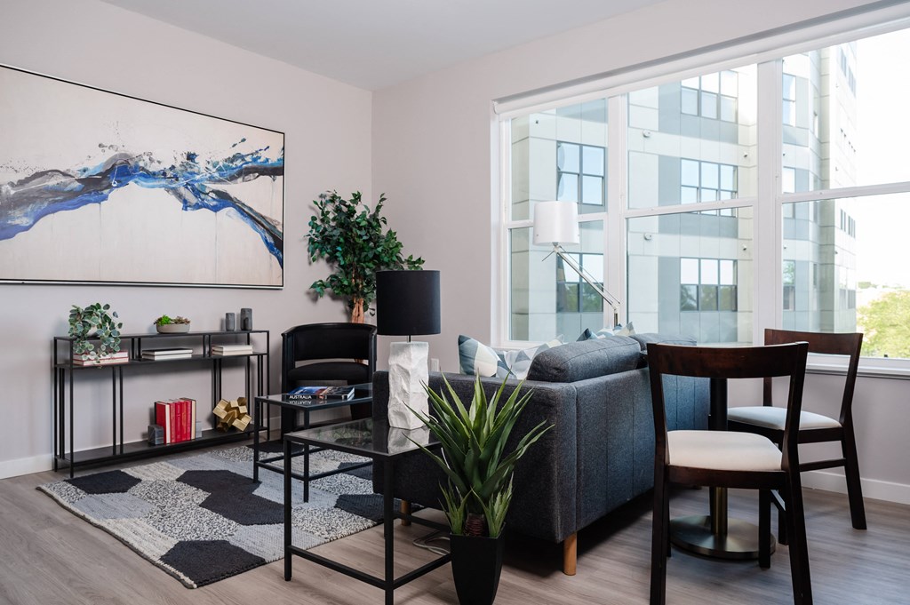 a living room with a couch and chairs and a table