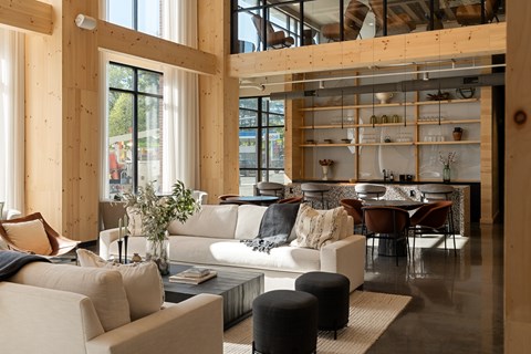 A modern living room with a large couch and a coffee table.