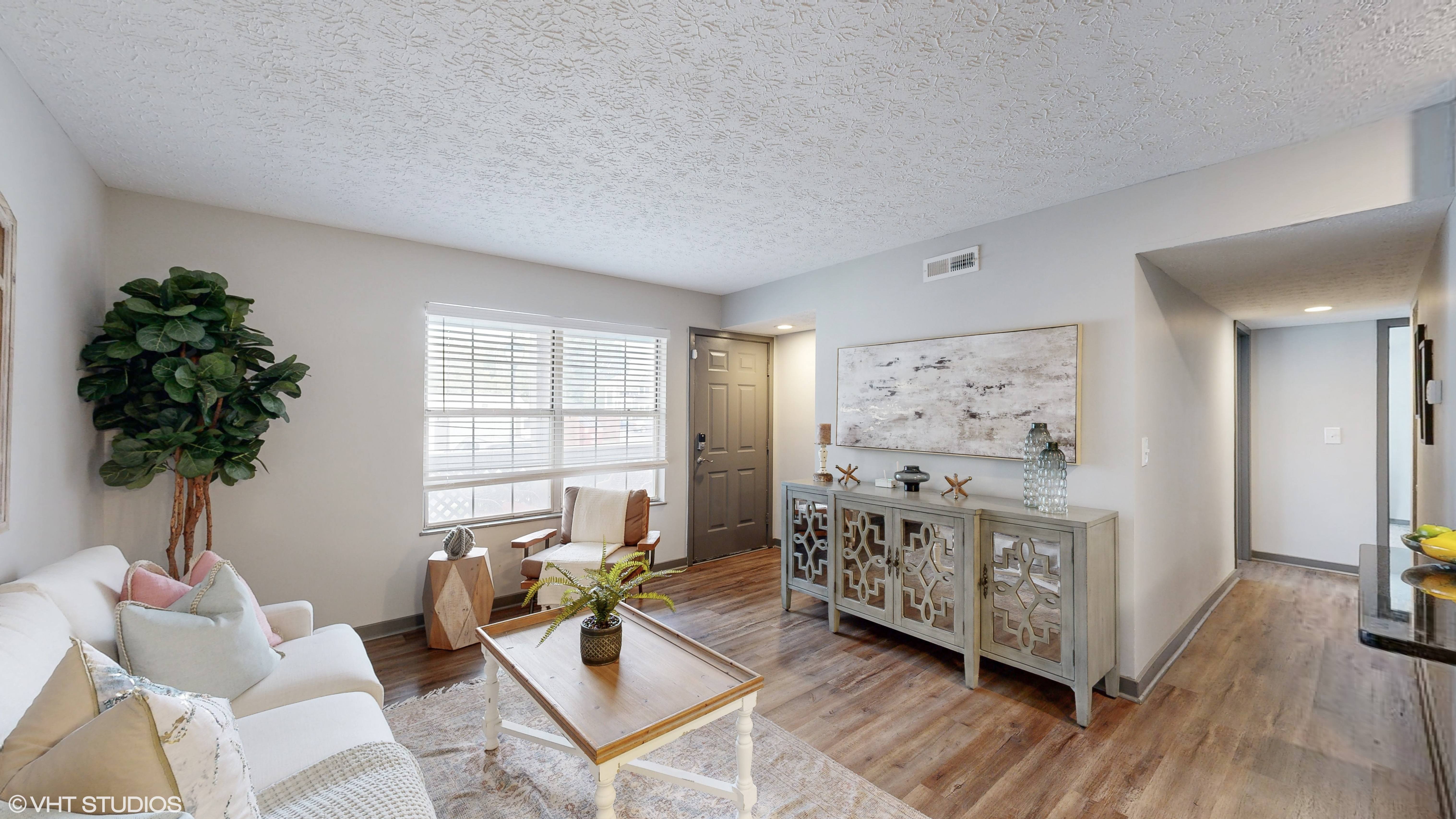 a living room with a couch and a table