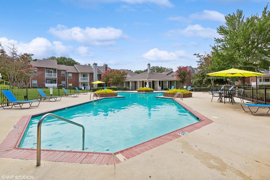 our apartments have a resort style pool with chairs and umbrellas our apartments have a resort style pool with chairs and umbrellas at The Nova Apartments, Memphis