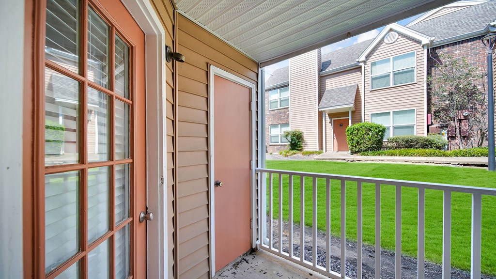 A view from a balcony looking out at a residential area. at The Local Apartments, Tennessee