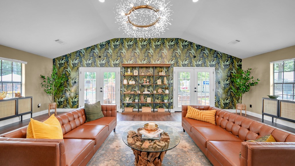 A living room with a brown leather couch and a coffee table.
