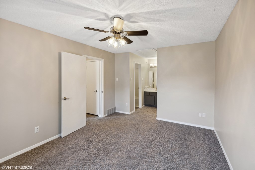 Empty bedroom with carpet and ceiling fan at The Birches Apartment Homes, Memphis