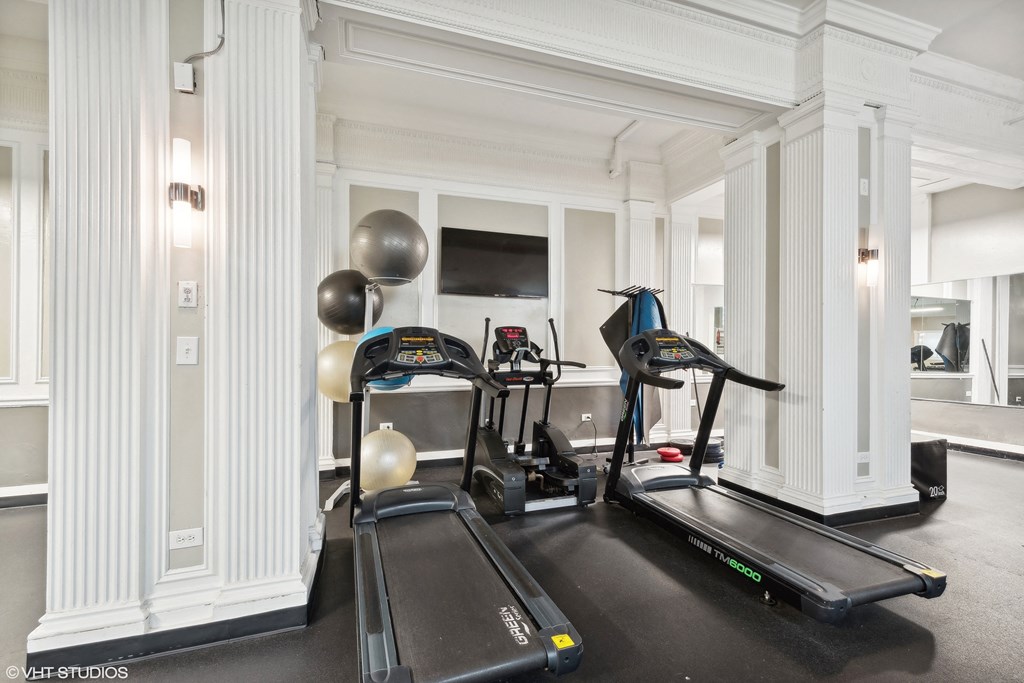 two treadmills in the gym of a hotel room at CWE Apartments, St. Louis, 63108