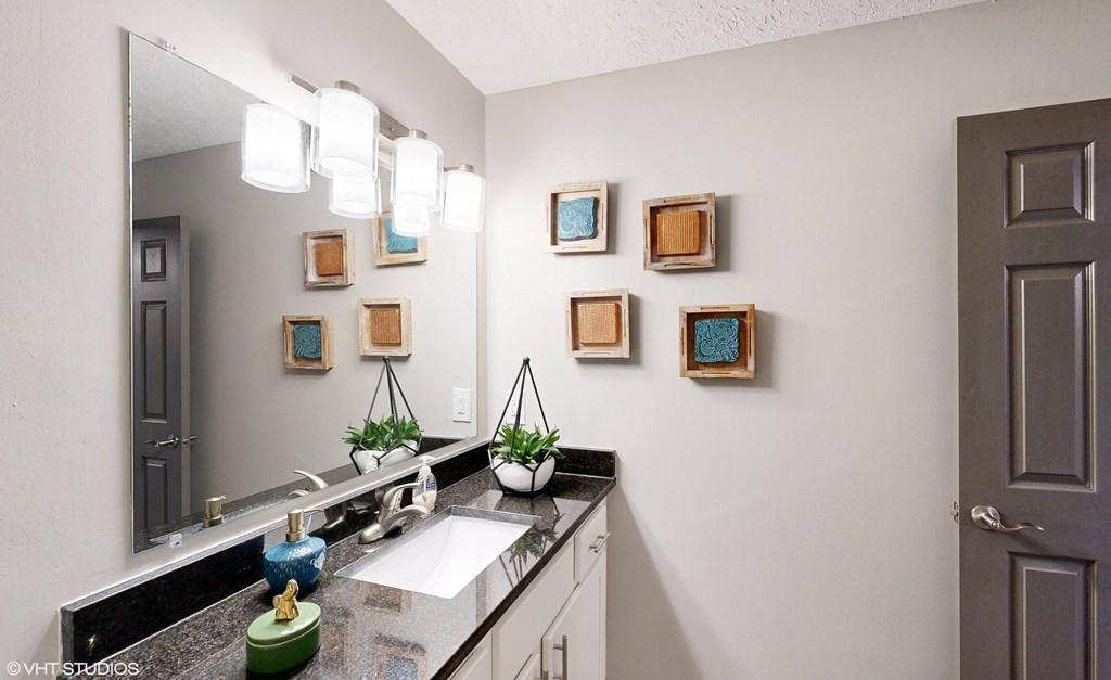 a bathroom with a sink and a mirror at Springburne at Polaris Apartments, Columbus, Ohio