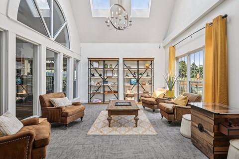 A living room with a brown sofa and a wooden coffee table.