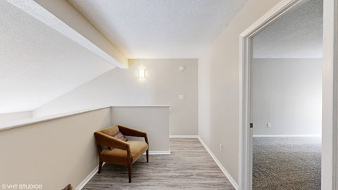 a living room with a couch and a chair in front of a window at The Vale Apartments and Townhomes, Tennessee, 38018