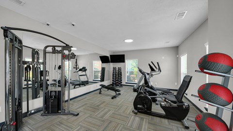 A well-equipped gym with a variety of exercise machines. at The District Apartments, Memphis, TN