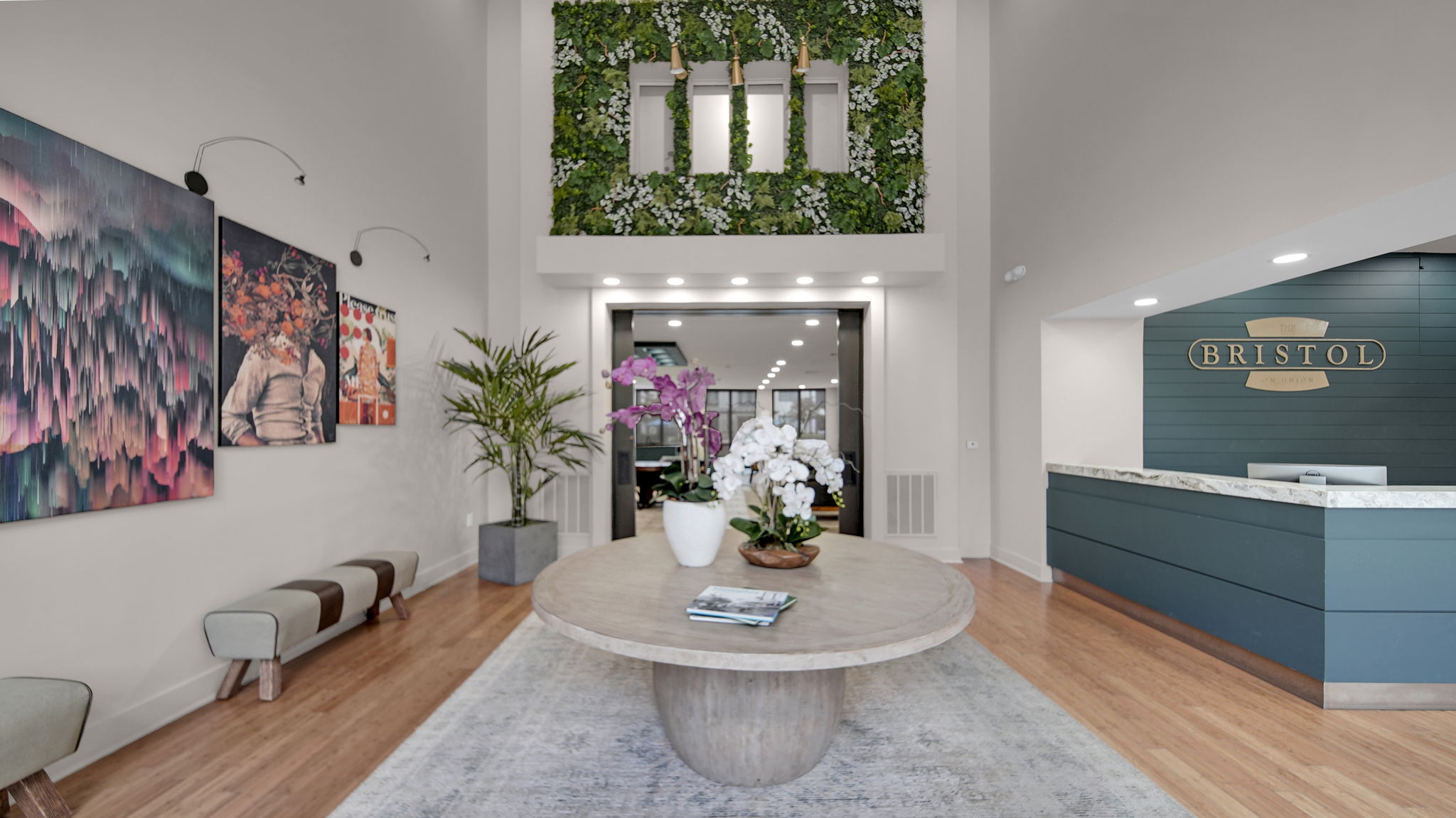 A living room with a large grey coffee table in the middle.