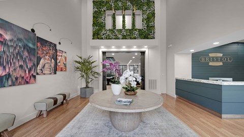 A living room with a large grey coffee table in the middle.