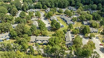 A bird's eye view of a residential area with houses and trees.