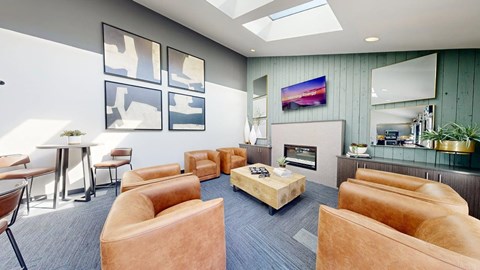 A modern living room with a skylight, a flat screen TV, and a coffee table.