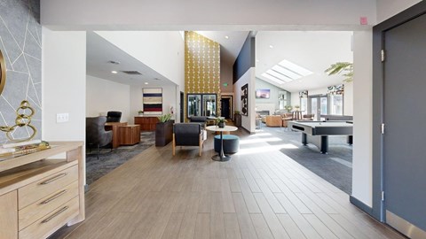 A spacious office lobby with a reception desk and seating area.