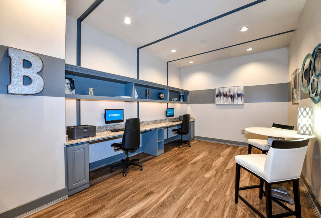 a room with two desks and two chairs