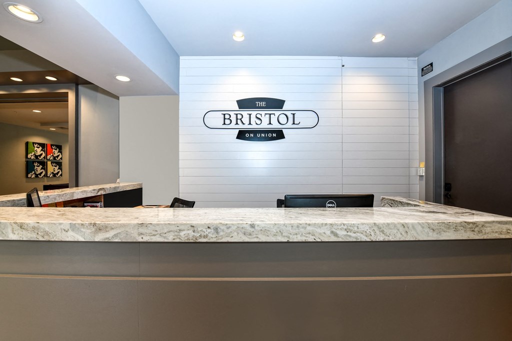 a reception desk with a sign that says bristol on it