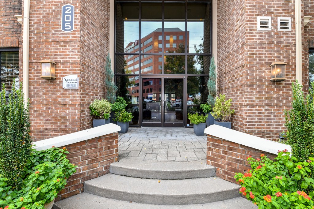 a brick building with a glass door