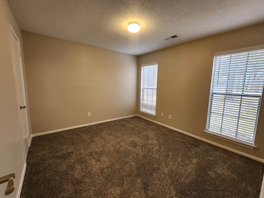 Wide Carpeted Bedroom at The Birches in Memphis