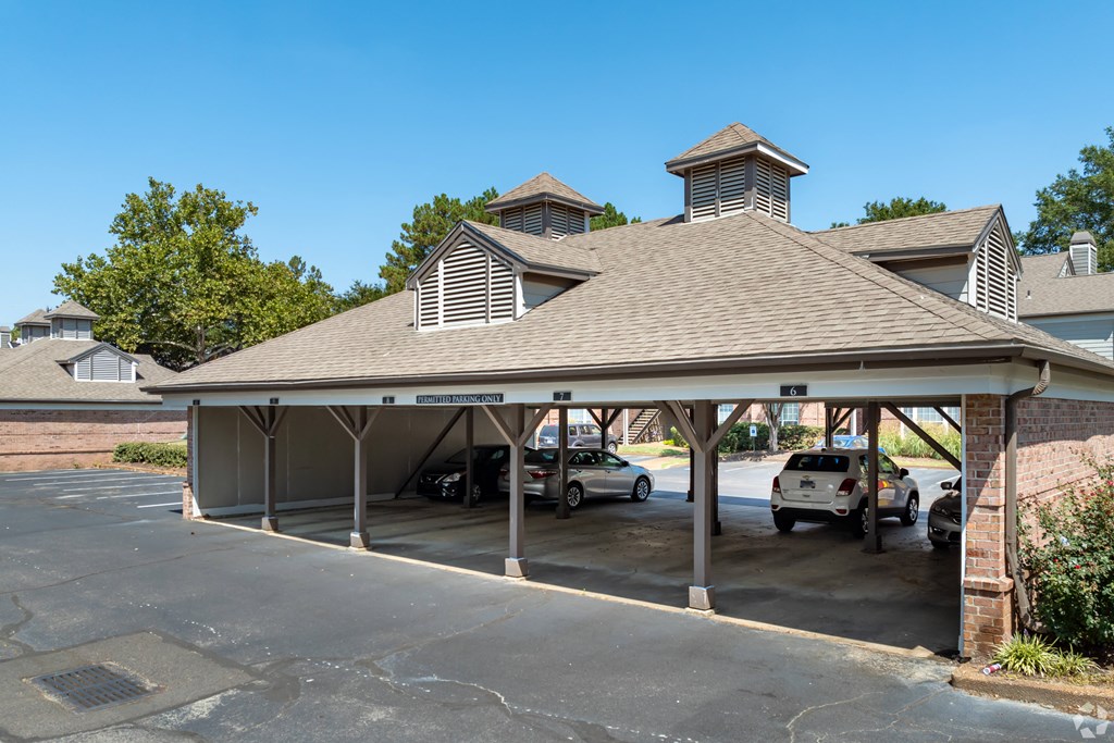 a car garage with cars parked in it at The Grove Germantown Apartments, Tennessee, 38138