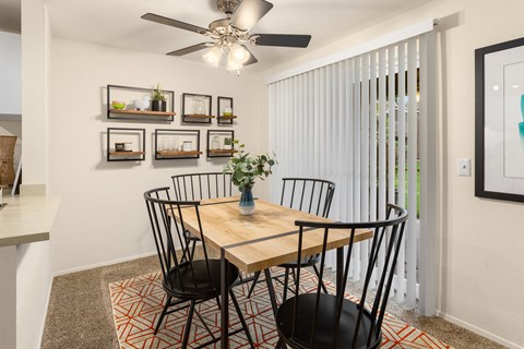Dining area with wooden table and decorative shelving at Bower Village Apartments, Washington, 98030