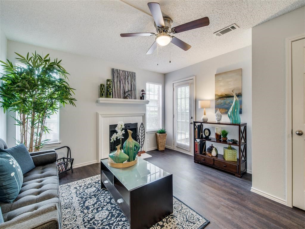 Luxurious Living Room Remodel With Standard Fireplace at Wildwood Apartments, CLEAR Property Management, Austin, TX, 78752