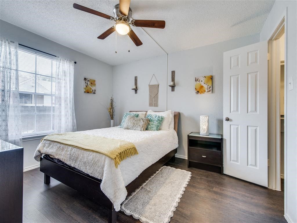 Beautiful Bright Bedroom With Wide Windows at Wildwood Apartments, CLEAR Property Management, Austin, Texas