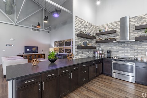 a kitchen with stainless steel appliances and a counter top
