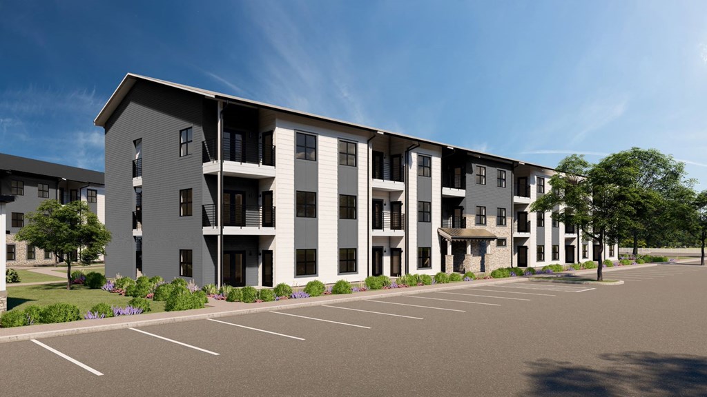 an architectural rendering of an apartment building with a parking lot at The Virginia, Seguin, TX
