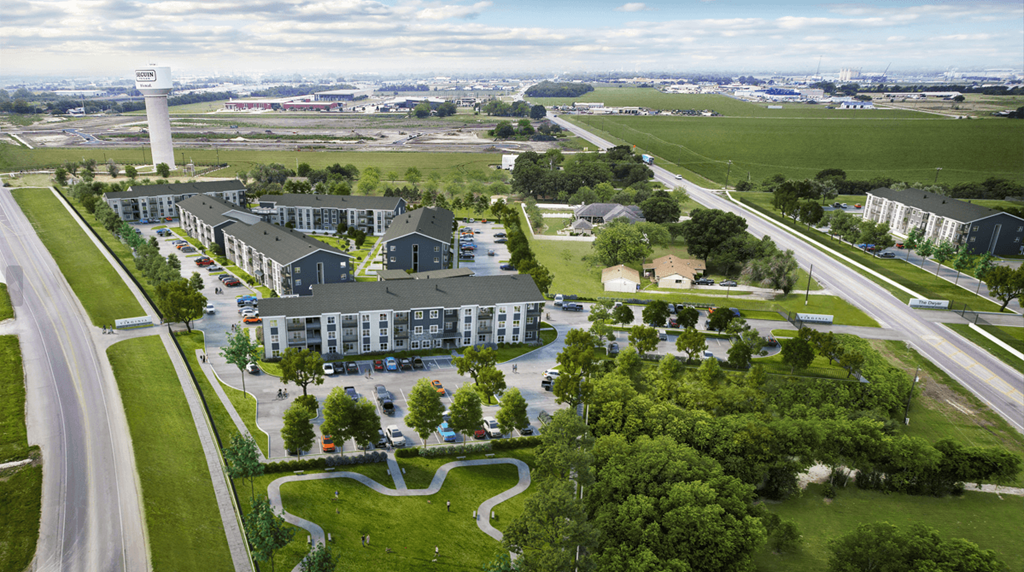 an aerial view of a building surrounded by trees and a highway at The Virginia, Seguin, 78155