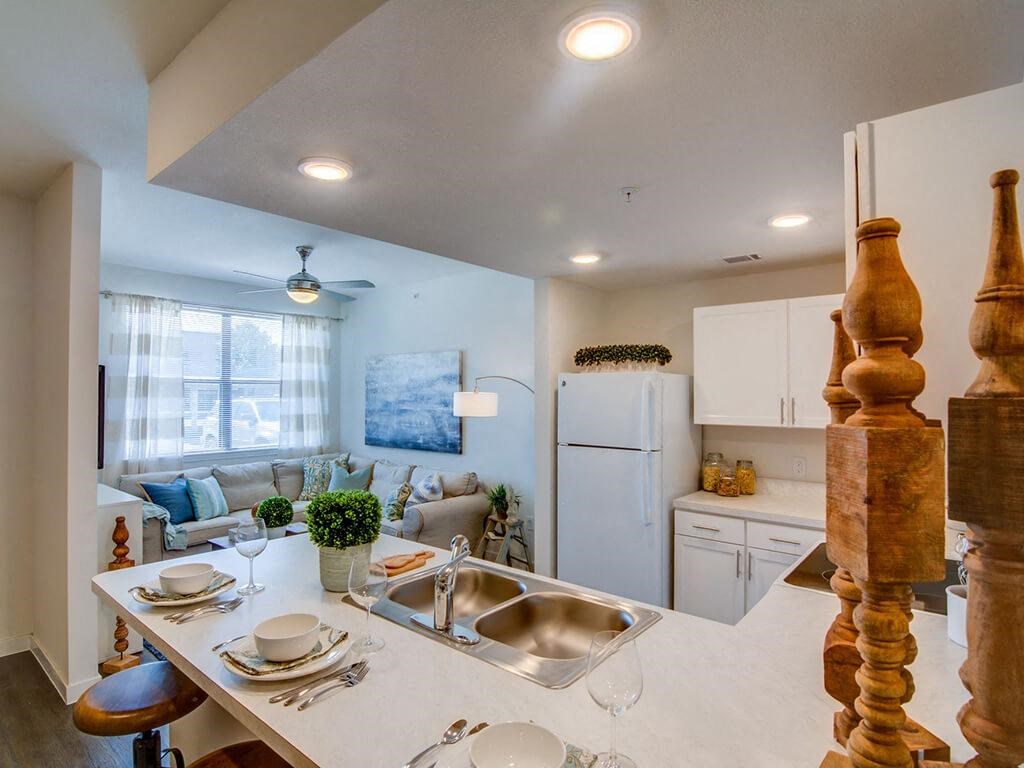 Living Room With Kitchen View at Aviator at Brooks Apartments, San Antonio, 78235
