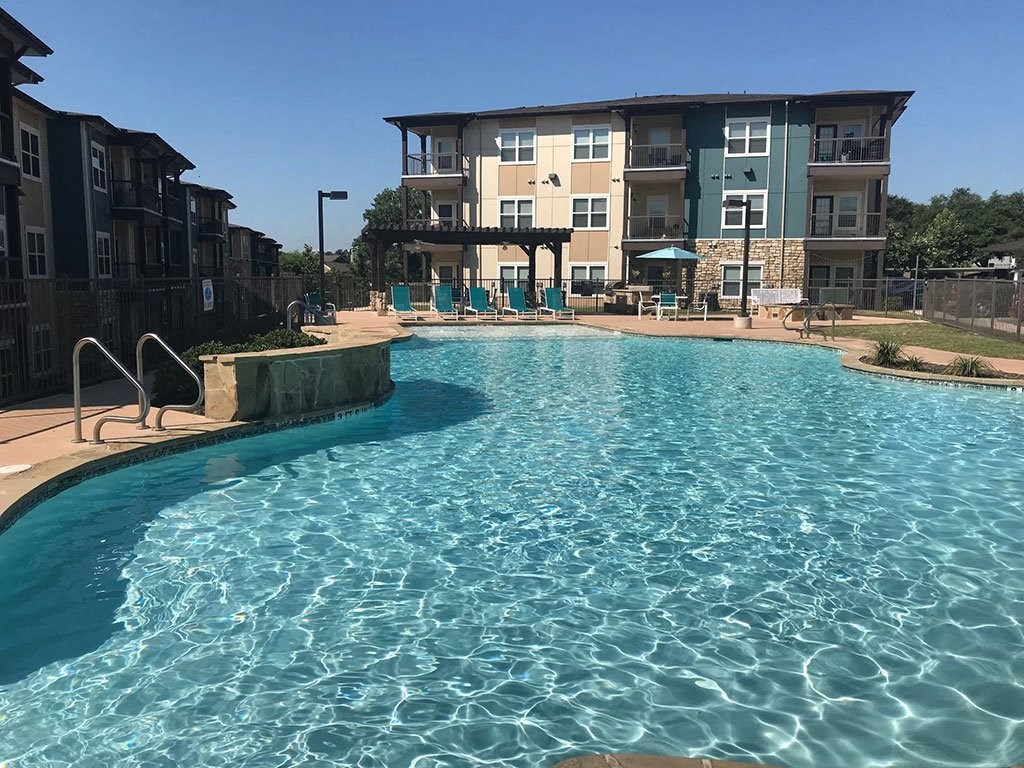 Invigorating swimming pool with sunning deck at CLEAR Property Management , The Lookout at Comanche Hill, San Antonio, TX, 78247