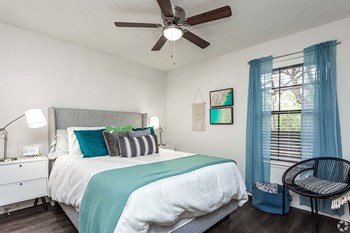 Beautiful Bright Bedroom With Wide Windows Beautiful Bright Bedroom With Wide Windows at Peppermill Apartments, CLEAR Property Management,, Universal City, Texas - Photo Gallery 3