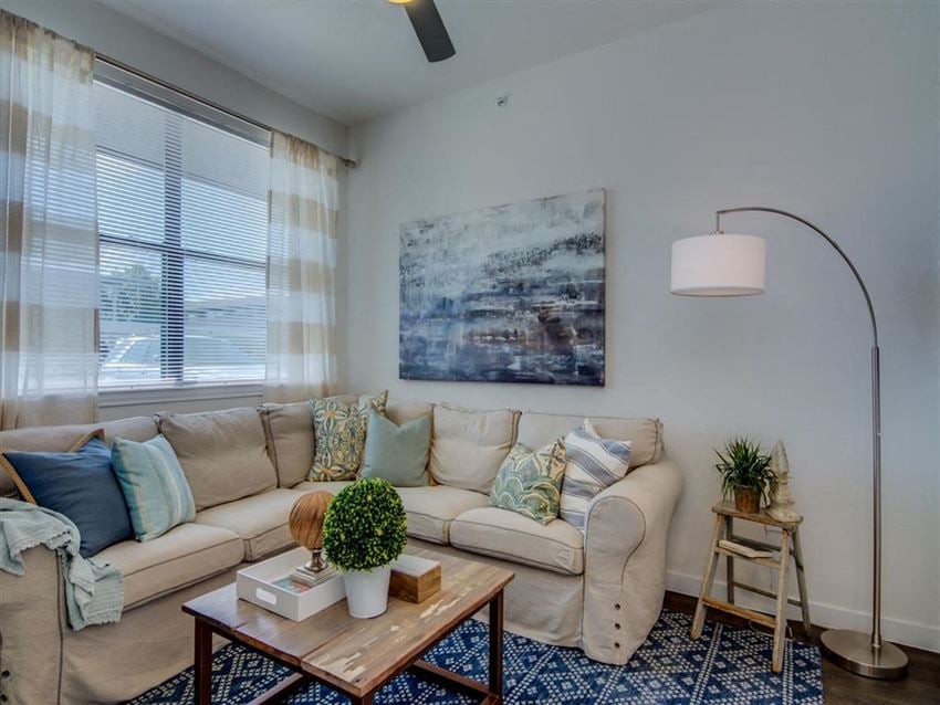 Living Room With Expansive Window at Aviator at Brooks Apartments, Clear Property Management, San Antonio, Texas - Photo Gallery 1