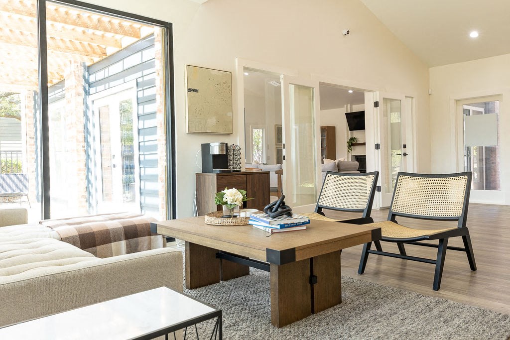a living room filled with furniture and a large window  at Sunset Canyon, San Antonio, TX