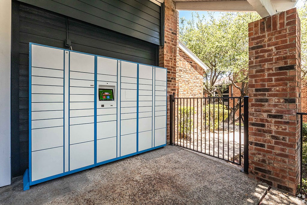 the front of a house with a white garage door and a black gate  at Sunset Canyon, San Antonio, 78232