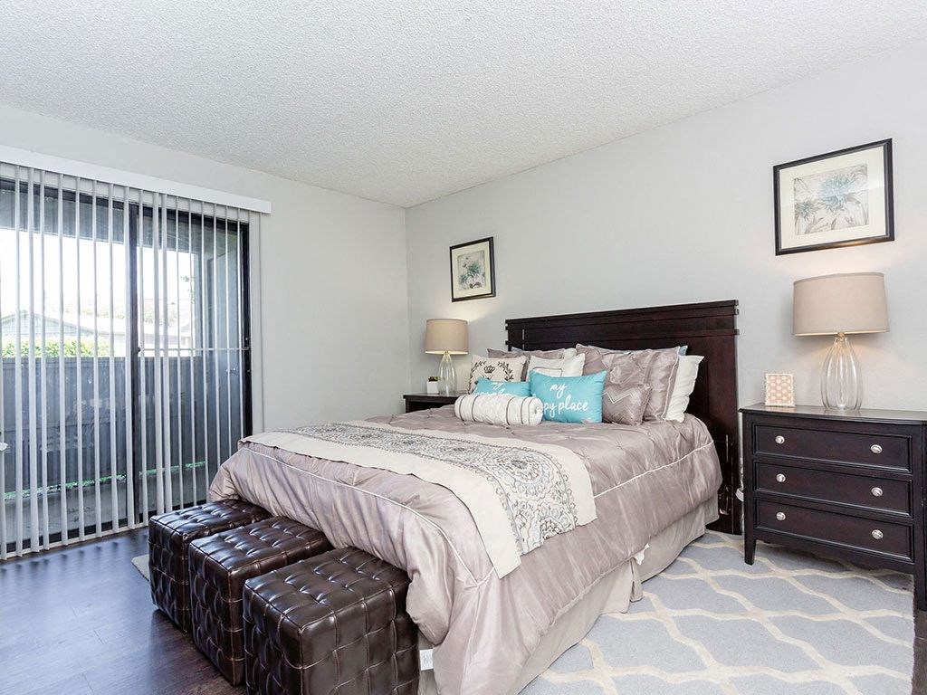 a bedroom with a bed and a window at Water Ridge Apartments, Irving, 75061
