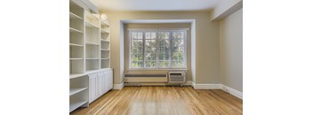 A room with a window and a radiator.