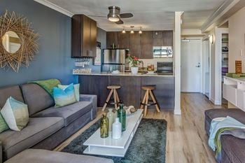 a living room with a kitchen and a couch
