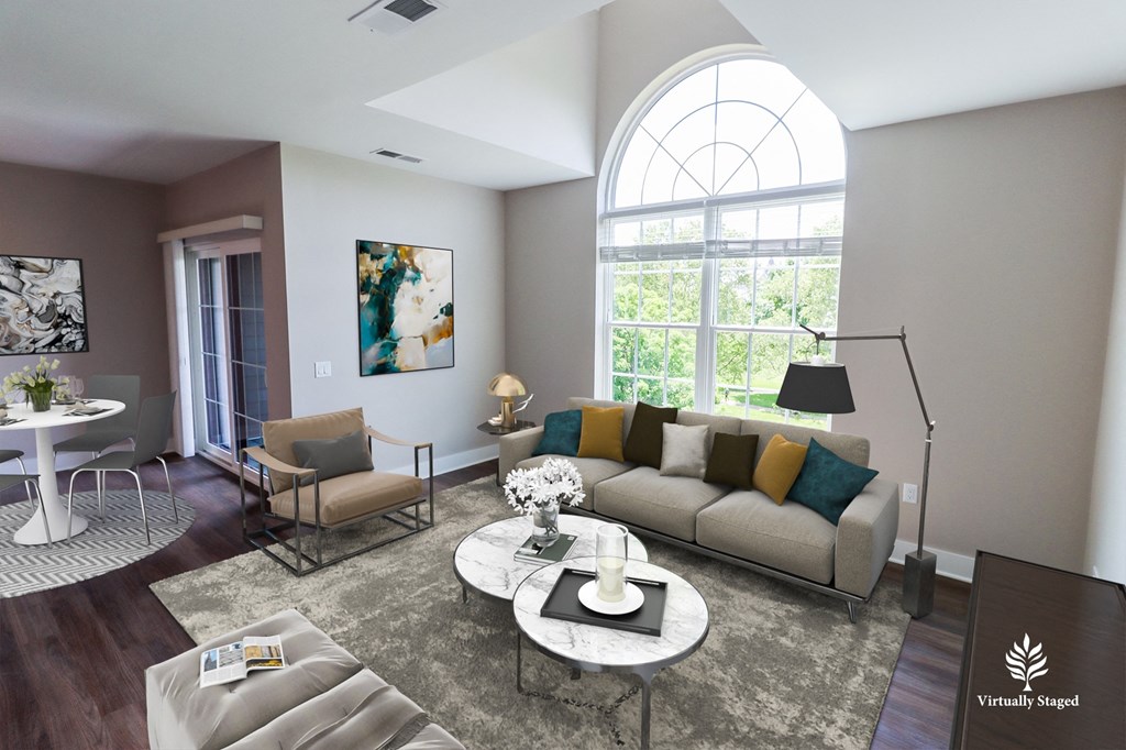 a living room with a large arched window