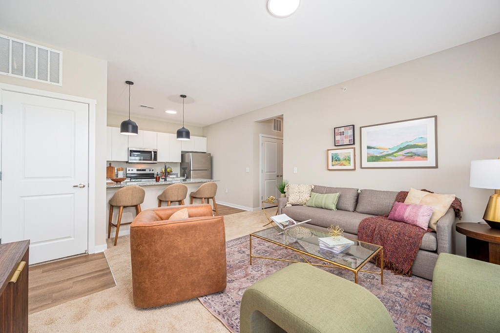 A living room with a grey couch and a coffee table.