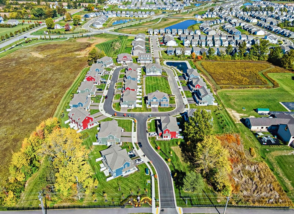 A suburban neighborhood with houses and a park.