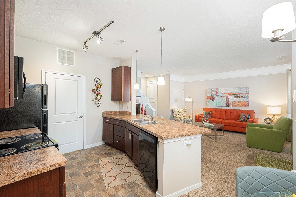 an open kitchen and living room with a counter top