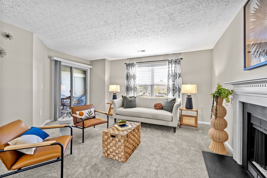 A living room with a fireplace and a couch.