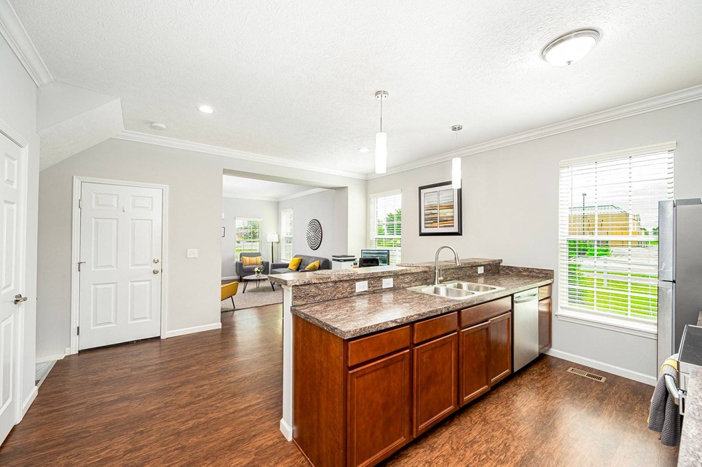a kitchen with a sink and a counter top
