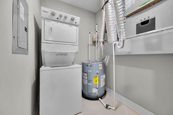 A kitchen with a stove, oven, and dishwasher.