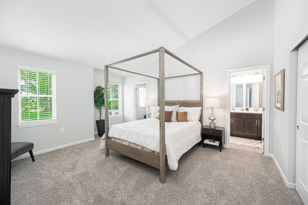 a bedroom with a four poster bed