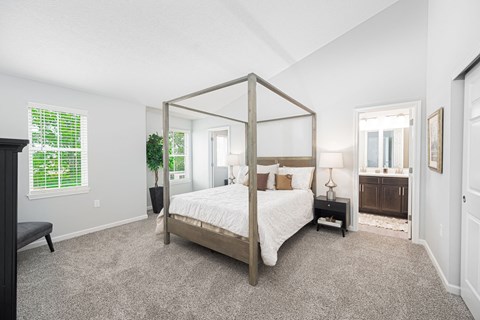 a bedroom with a four poster bed