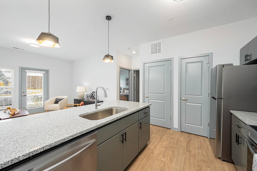 a kitchen with stainless steel appliances and a counter top